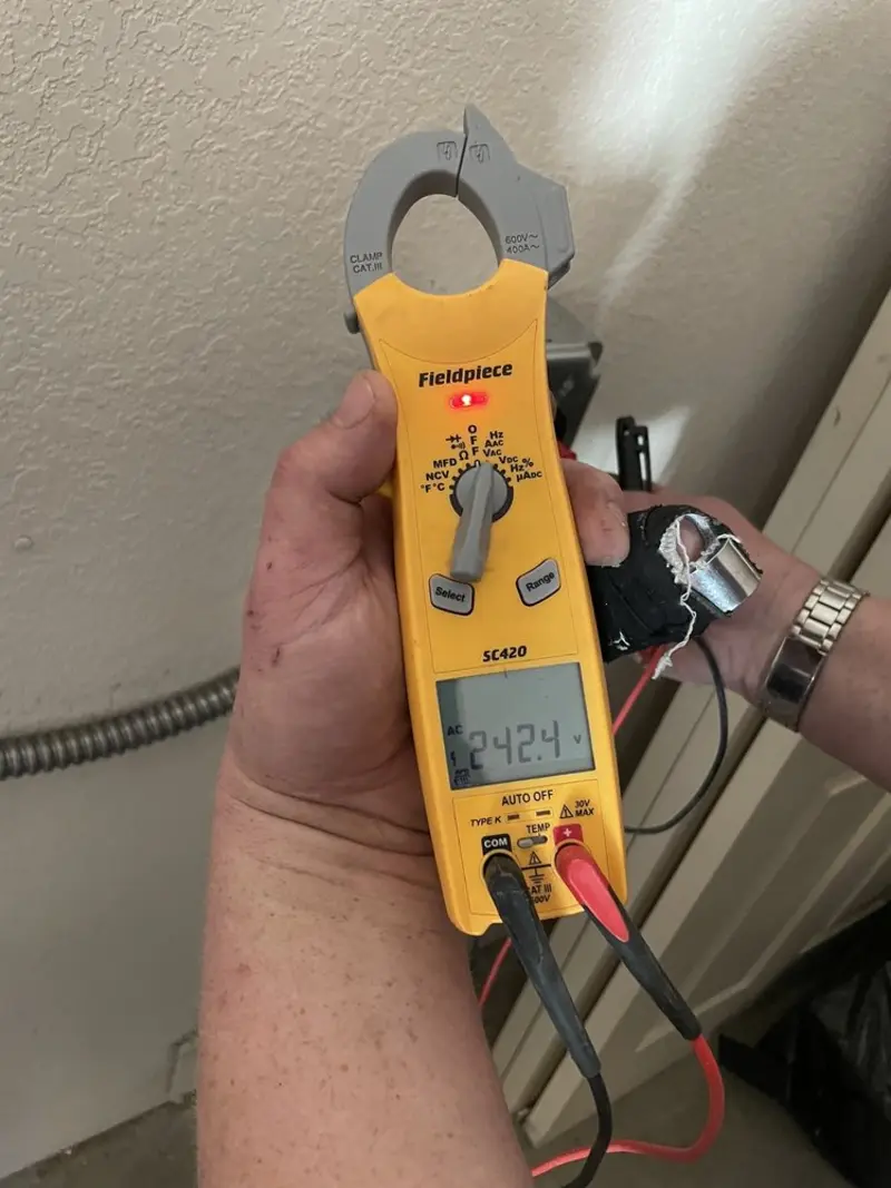Voltage testing with clamp meter during Generator Installation in DeWitt
